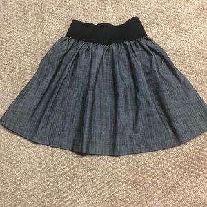 Grey pleated skirt with black high waist band
